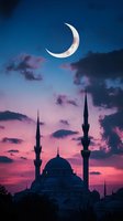Crescent moon illuminating dramatic sunset sky over mosque silhouette with twin minarets against purple and blue clouds during magical evening atmosphere.