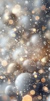 Magical glowing bokeh lights on blurred background with sparkles and snow particles creating dreamy festive atmosphere for holiday designs.