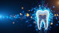 Digital tooth with glowing network connections and particles on blue background for dental technology and healthcare innovation concepts.