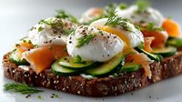 Gourmet open sandwich with poached eggs, smoked salmon, fresh cucumber slices, and dill garnish on seeded whole grain bread.