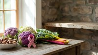 Fresh organic vegetables including purple cauliflower with pink ribbon on rustic wooden table near window. Healthy eating and cancer awareness concept.