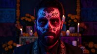 Man with colorful skull face paint in traditional Day of the Dead celebration with marigold flowers and candles creating atmospheric lighting for cultural festival.