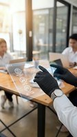 Businessman in black gloves using futuristic transparent tablet with digital interface icons in modern office meeting room for technology presentations.