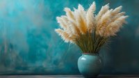 Fluffy white pampas grass bouquet in turquoise ceramic vase against teal textured wall background, creating moody atmospheric home decor composition.