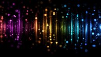 Vibrant rainbow spectrum of glowing particles and light streaks falling against dark background creates magical atmospheric effect for festive designs.