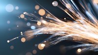 Bright sparks and metal shavings flying during industrial metalworking process against dark background with bokeh light effects, macro photography.