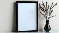 Minimalist black photo frame mockup with black ceramic vase and dried branches against white wall, modern home decor styling for artwork presentation.