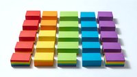 Colorful stacked boxes arranged in five columns of red, yellow, green, blue, and purple isolated on white background for design projects.