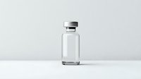 Empty medical glass vial with aluminum cap on white surface against light gray background, minimalist pharmaceutical container for medicine or vaccine.