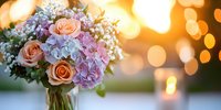 Romantic bouquet with peach roses and pastel hydrangeas in glass vase against golden sunset bokeh background, soft dreamy wedding atmosphere.