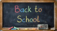 Back to School written in colorful chalk on blackboard with eraser and chalk pieces for education and learning concepts.