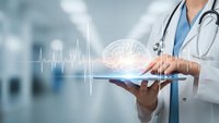 Healthcare professional using digital tablet with holographic brain and heartbeat display in modern medical facility for neurological diagnosis.