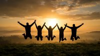 Five friends jumping together with raised arms against golden sunset sky, celebrating success and friendship on mountain hilltop with dramatic clouds and warm light.