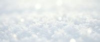 Close-up of fresh snow crystals with soft bokeh effect, suitable for winter backgrounds, seasonal designs, and holiday marketing materials.