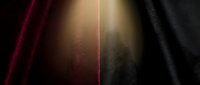 Luxurious velvet fabric in deep burgundy and black with golden light rays creating elegant texture and depth for premium design projects.
