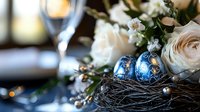Elegant Christmas table setting with blue ornamental balls in decorative nest, white roses and festive bokeh lights creating magical holiday atmosphere.