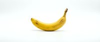 Single ripe yellow banana isolated on white background, ready for design use in food, nutrition, and healthy eating projects.