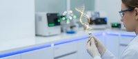 Female scientist examining DNA double helix model in modern laboratory for genetic research and biotechnology studies.