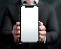 Professional businessman holding smartphone with blank white screen mockup for app presentation and mobile technology demonstration.