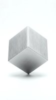 Brushed metal cube floating on white background with geometric shadows and reflective surface for modern design projects.