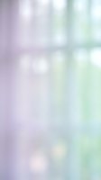 Soft pastel gradient background with dreamy bokeh lights in purple and mint green tones for spring designs and romantic projects.