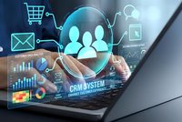 Business professional using laptop with CRM system interface displaying customer data analytics, charts and digital icons for sales management technology.