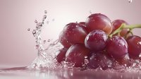 Fresh red grapes with water splash and droplets on pink background, macro photography showing juicy fruit texture and dynamic liquid motion in studio light.