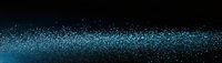 Glowing blue particles scattered on black background creating magical sparkle effect, panoramic composition for festive and cosmic design projects.