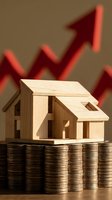Wooden house model on coin stacks with red growth arrows showing real estate investment success and property value increase concept.