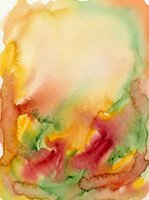 Watercolor abstract background with vibrant yellow, orange, red, and green flowing washes creating organic shapes. Soft blending and translucent layers ideal for artistic projects and creative designs.