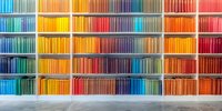 Colorful books arranged by spectrum colors on white shelves creating rainbow pattern, organized library collection against white wall for modern interior design.