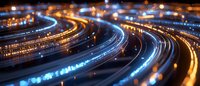 Curved light trails on highway at night with bokeh effect and motion blur creating abstract urban transportation pattern in blue and orange tones.