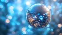 Sparkling disco ball with mirror tiles reflecting blue lights creating magical bokeh effect for party and nightclub entertainment backgrounds.