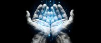 Open hands holding glowing blue digital pills or capsules with light effects against dark background for healthcare and pharmaceutical concepts.