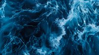 Swirling blue abstract liquid pattern with dynamic flowing movement and ethereal smoke-like textures creates dramatic artistic background for creative projects.