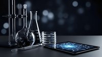 Modern laboratory glassware with digital tablet displaying molecular structure on dark background for scientific research and technology applications.