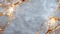 Luxurious gray marble texture with golden veins and cracks on stone surface. Natural pattern creates elegant backdrop for luxury interior design projects.