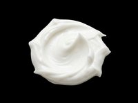 Creamy white swirl of whipped cream or cosmetic mousse, isolated on transparent background, ready for food, beauty, and skincare design projects, stickers, and print on demand.