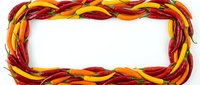 Twisted red, yellow, and orange chili peppers forming a decorative rectangular frame border on white background for food, cooking, and culinary design projects.