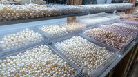 Fresh organic eggs displayed in market trays showing variety of brown and white farm eggs for healthy cooking and baking ingredients at grocery store.