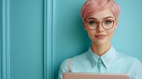 Young professional woman with pink hair and glasses holding laptop against turquoise background for business presentations and corporate communications.