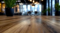 Modern office interior with wooden floor in blur focus, empty business space with natural light and potted plants, contemporary workspace design.