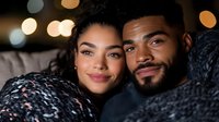 Young diverse couple sharing intimate moment at home, heads together, warm bokeh lights in background, cozy winter evening atmosphere creates romantic mood.