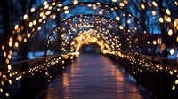 Illuminated wooden bridge with warm golden lights creating magical archway tunnel at dusk. Romantic walkway with glowing bokeh effects for holiday decorations.