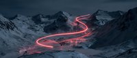 Glowing neon red light trail curves through snow-covered mountain valley at dusk, creating surreal landscape for digital art, gaming, and creative design projects.