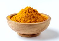 Vibrant yellow turmeric powder heaped in wooden bowl on white background, popular spice used in cooking and natural medicine.