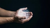 Hands holding glowing digital globe hologram against dark background, representing global connectivity, technology innovation, and worldwide business communication networks.