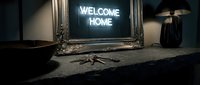 Neon welcome home sign glowing in ornate silver frame on dark stone surface with keys and lamp, cozy entryway interior decor concept.