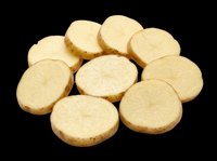 Sliced raw potato rounds isolated on transparent background, ready for food design, stickers, print on demand, T-shirts, clipart, and sublimation projects.