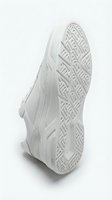 White sneaker sole detail showing geometric tread pattern, monochrome athletic shoe on light background for footwear and fashion design use.